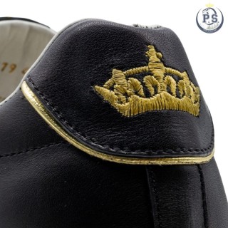 Sneakersy Siena z czarnej skóry ze złotymi detalami